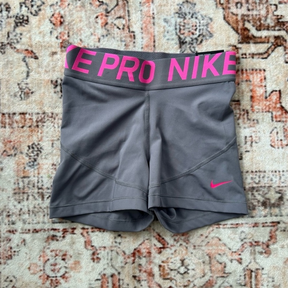 Nike Pro Women's Gray Athletic Shorts with Pink Logo and Waistband